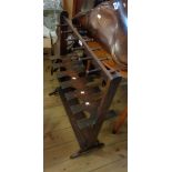 A 65cm 19th Century mahogany freestanding boot rack with flanking pegs to top and undertier, set
