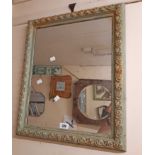 A cast resin framed French style oblong wall mirror