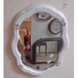 A modern china framed mirror with stencilled floral decoration and shape plate