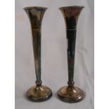 A pair of 21.5cm silver slender trumpet vases with loaded circular bases - London 1977