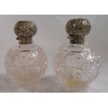 A pair of silver flip-top hobnail cut glass spherical scent bottles