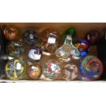 A small box containing a quantity of glass paperweights including Caithness, millefiori, etc.
