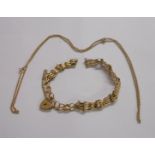 A broken (375) 9ct. gold gate-link bracelet with heart shaped padlock and safety chain - sold with a