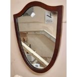 A small walnut framed shield shaped wall mirror - from a dressing table mirror