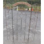 A modern wrought metal plant trellis