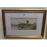 Tom Lloyd: a gilt framed watercolour, depicting a waterside windmill and rowing boat - ink written