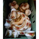 A crate containing a quantity of Old Country Roses tea and dinnerware including trios, meat