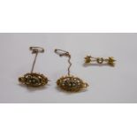 A pair of late Victorian unmarked yellow metal and seed pearl brooches - sold with a marked 9/375