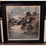 A framed Japanese silk picture depicting a view of Mount Fuji with river landscape in foreground -