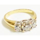 A marked 750 yellow metal three stone diamond ring