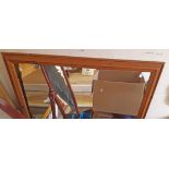 A modern stained pine framed oblong wall mirror - 1.02m X 1.35m