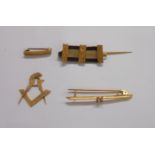 A George Kenning cased marked 9ct miniature Masonic stick pin jewel with set square and compasses
