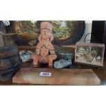 A selection of collectable items including carved Tiki mask, onyx cribbage board, etc.
