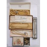 A box containing vintage boxed simulated pearl necklaces and other costume jewellery