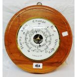 A modern Baromaster polished wood cased wall barometer with visible aneroid works to dial centre