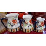 A set of three Losol Ware graduated jugs decorated in the Shanghai pattern