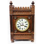 A late 19th Century Aesthetic style oak mantle clock with German eight day gong striking movement