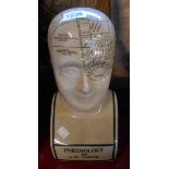 A modern ceramic phrenology head with crackle effect glaze