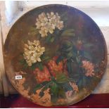 Three large Watcombe Torquay terracotta platters, the largest decorated with a floral still life