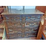A 1.1m Jacobean style antique oak chest of four long graduated drawers with applied moulding and