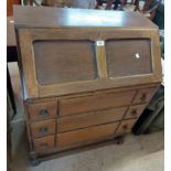 A 76cm 20th Century oak bureau with part fitted interior and drawers under