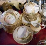 An Edwardian porcelain part tea set with Art Nouveau style decoration