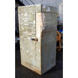 A vintage metal locker cabinet with curved front - dented