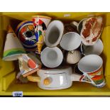 A crate containing a quantity of ceramic items including Saddler, Clarice Cliff style teapot,