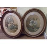 A pair of old gilt framed oval watercolours, both floral studies - fading