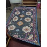 A modern Indian handmade rug by Anthropologie with decoration woven piping in geometric designs -