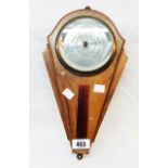 A vintage walnut veneered Art Deco style wall barometer/thermometer with aneroid works by Comitti of