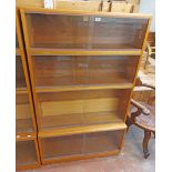 A 91cm vintage Simplex teak effect four section modular bookcase with sliding glass doors and deep