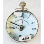 A ball shaped bull's-eye glass mounted desk timepiece with battery movement