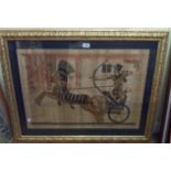 A large gilt framed reproduction papyrus picture, depicting King Tut hunting from a chariot -