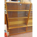 A 91cm vintage Simplex teak effect four section modular bookcase with sliding glass doors and deep