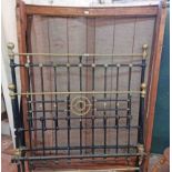 A 1.37m late Victorian brass and painted cast iron double bedstead with brass pommel finials and