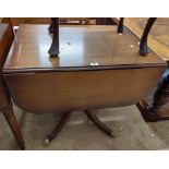 An 81cm reproduction mahogany drop-leaf table, set on turned pillar and swept legs with lion paw
