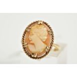 A YELLOW METAL CAMEO RING, the claw set cameo of oval design, depicting a lady in profile, within