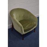 A GUY ROGERS FRISCO BAY TUB CHAIR, covered in green upholstery on a teak stylised frame (this