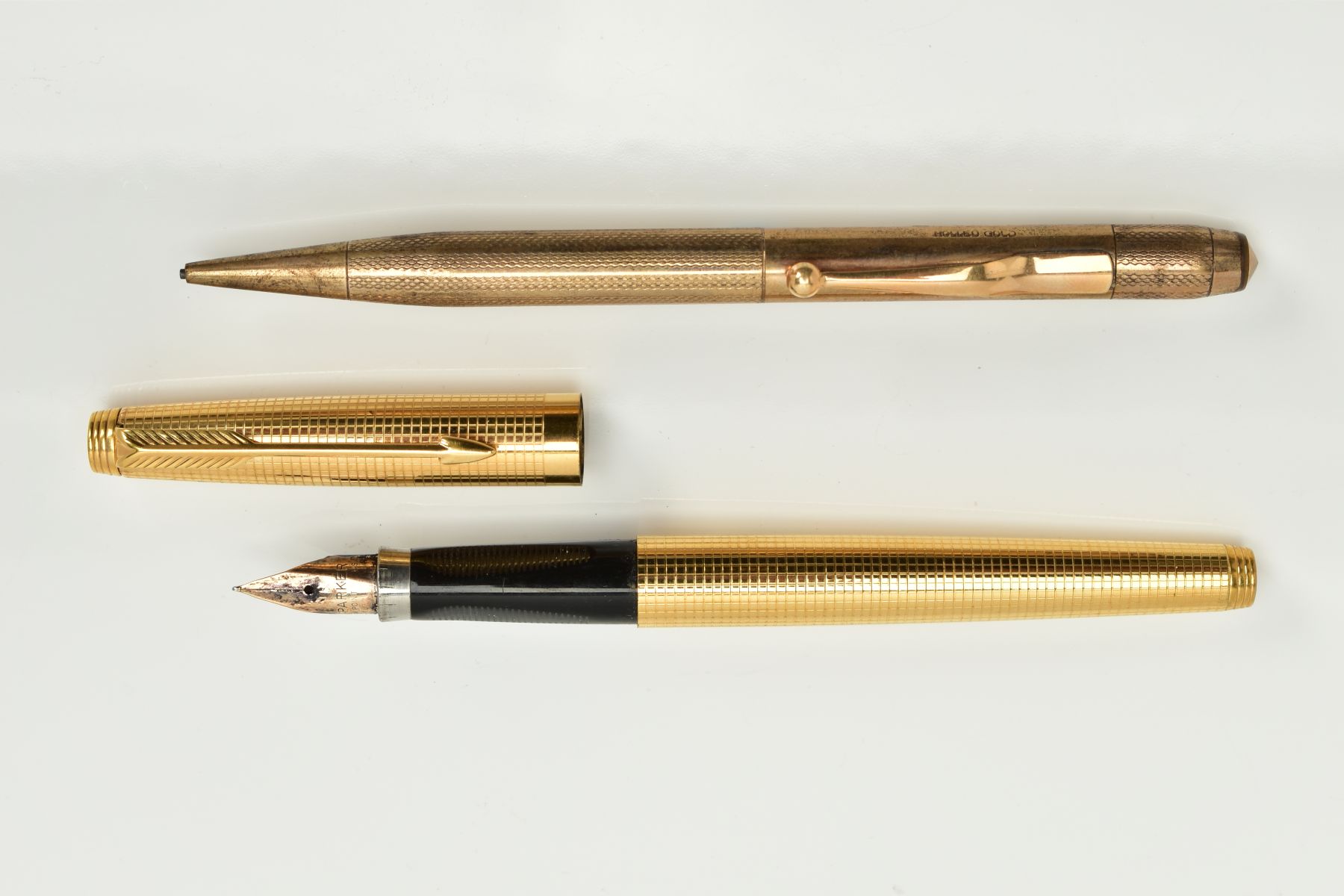 A PARKER '75' 14CT ROLLED GOLD CICELE FOUNTAIN PEN, in almost mint condition, and a rolled gold