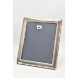 A SILVER PHOTO FRAME, of a plain polished rectangular form, hallmarked Sheffield 2003, approximate