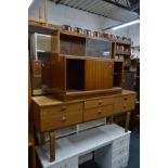 A MINTY TEAK TWO SECTION BOOKCASE, together with a Schreiber teak dressing table (2)