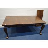 A VICTORIAN MAHOGANY WIND OUT DINING TABLE, including two leaves, on cabriole legs, extended