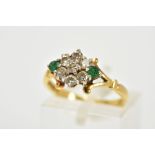 AN 18CT GOLD, DIAMOND AND EMERALD CLUSTER RING, designed as a lozenge shape set with seven round