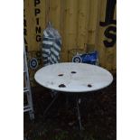A METAL CIRCULAR GARDEN TABLE, diameter 106cm x height 76cm, two folding metal chairs, parasol