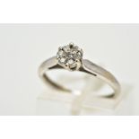 AN 18CT WHITE GOLD DIAMOND CLUSTER RING, the small cluster set with seven round brilliant cut