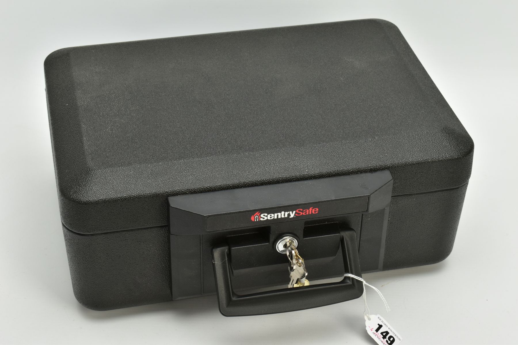 A BLACK SENTRYSAFE 1100 FIRE CHEST, fitted with a carrying handle, serial number to the inside of