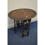 A SMALL EARLY TO MID 20TH CENTURY CARVED OAK DROP LEAF TABLE, on turned legs, open width 82.5cm x
