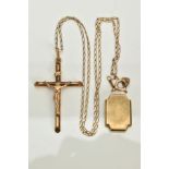 A YELLOW METAL CROSS PENDANT NECKLACE AND A WATCH CASEBACK, the cross and Christ pendant, stamped