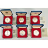 A SET OF SIX INDIVIDUALLY CASED 1952-1977 COMMEMORATIVE COINS, each with a design of the issuing